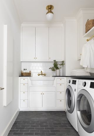 small laundry room ideas white neutral color palette with brass finishes by Marie Flanigan Interiors