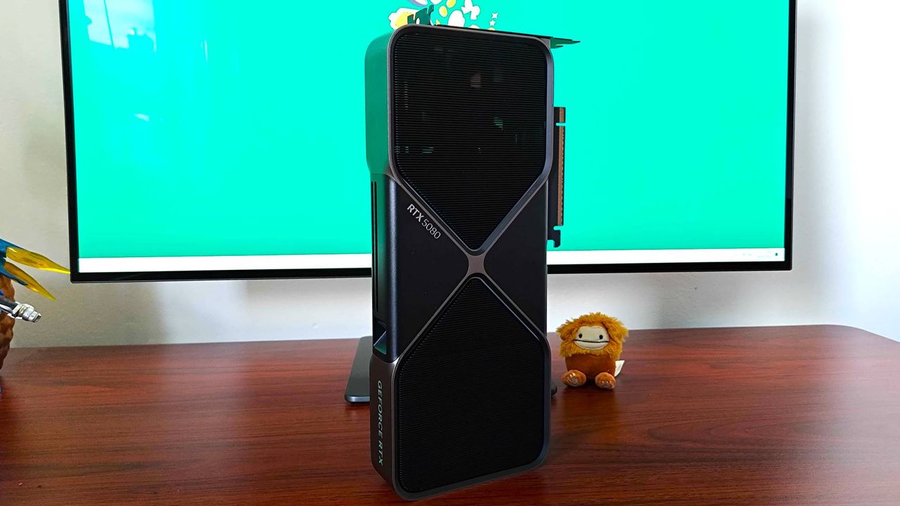 Nvidia GeForce RTX 5080 standing upright on woodgrain desk