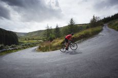 Cyclist riding up devil's staircase wales