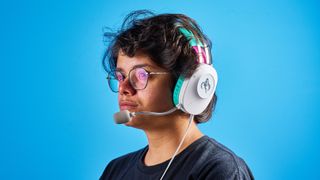 A person wearing an Asus TUF Gaming H1 Gen II headset