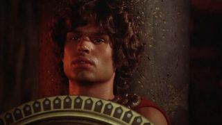 A close up of Harry Hamlin holding a shield in Clash of the Titans