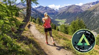 Woman running on mountain trail