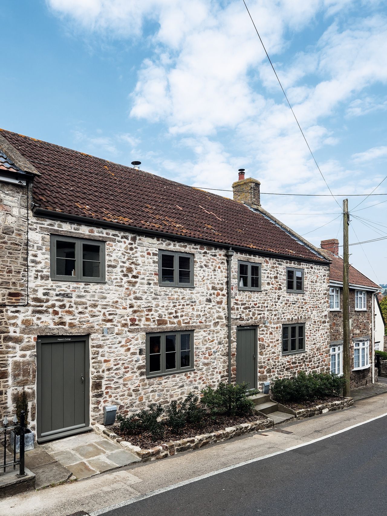 two stone workers cottage on road