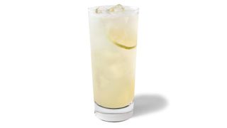 Tall glass with ice containing Starbucks Cool Lime Refresha® Drink