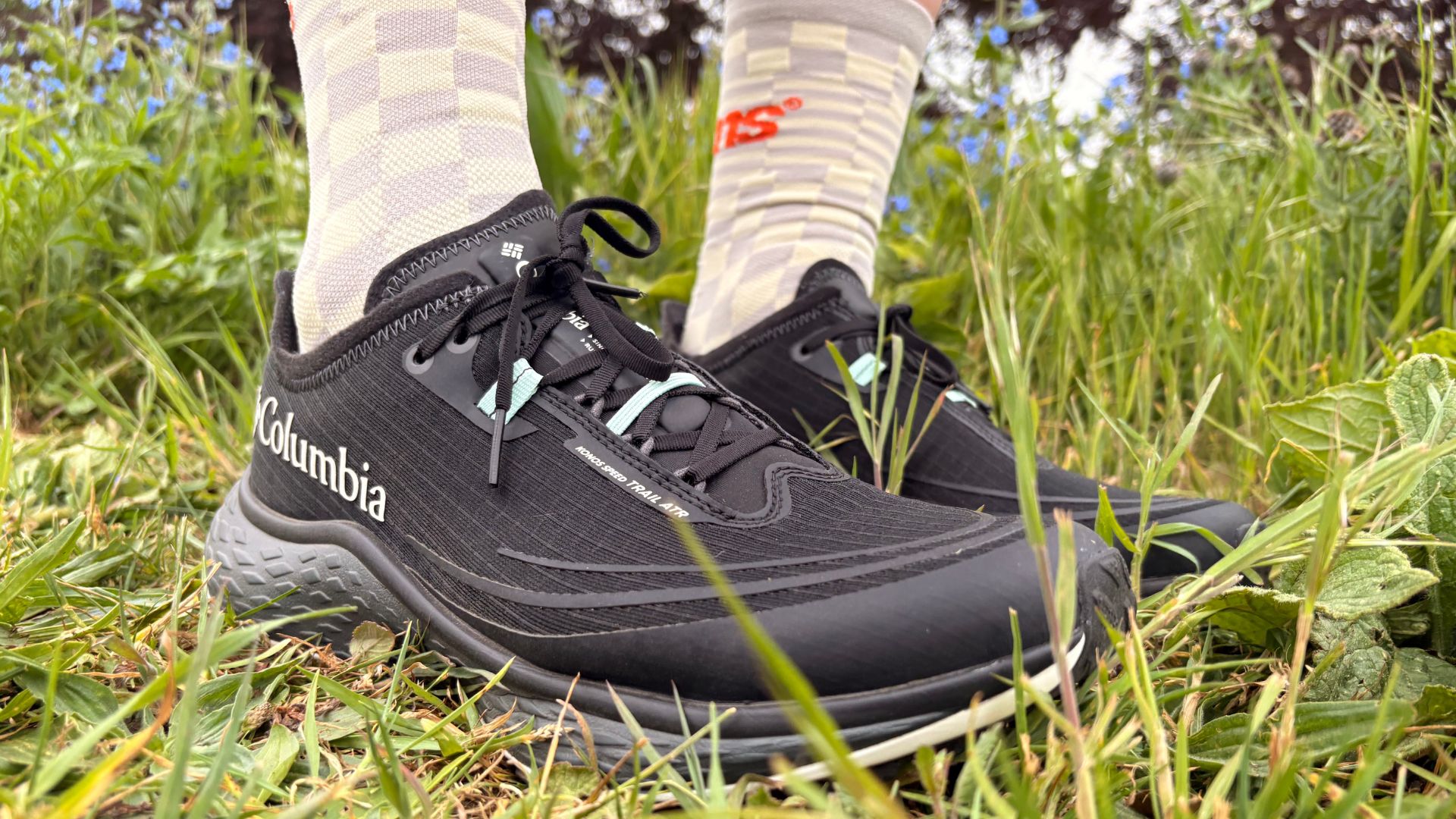 Grace Walsh wearing the Columbia Konos Speed Trail Shoes on grass