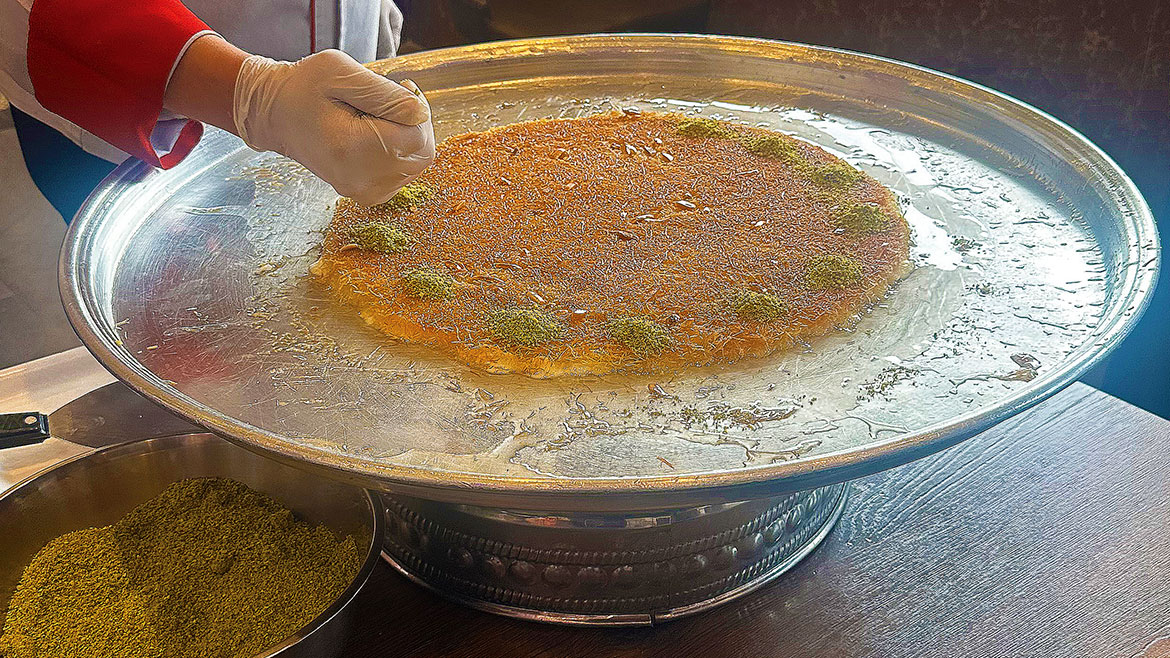 Knafeh being made
