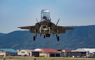 A U.S. Marine Corps F-35B Lightning II with Marine Fighter Attack Squadron 121, hovers overhead before conducting a vertical landing at Marine Corps Air Station Iwakuni in Japan on June 13, 2017.