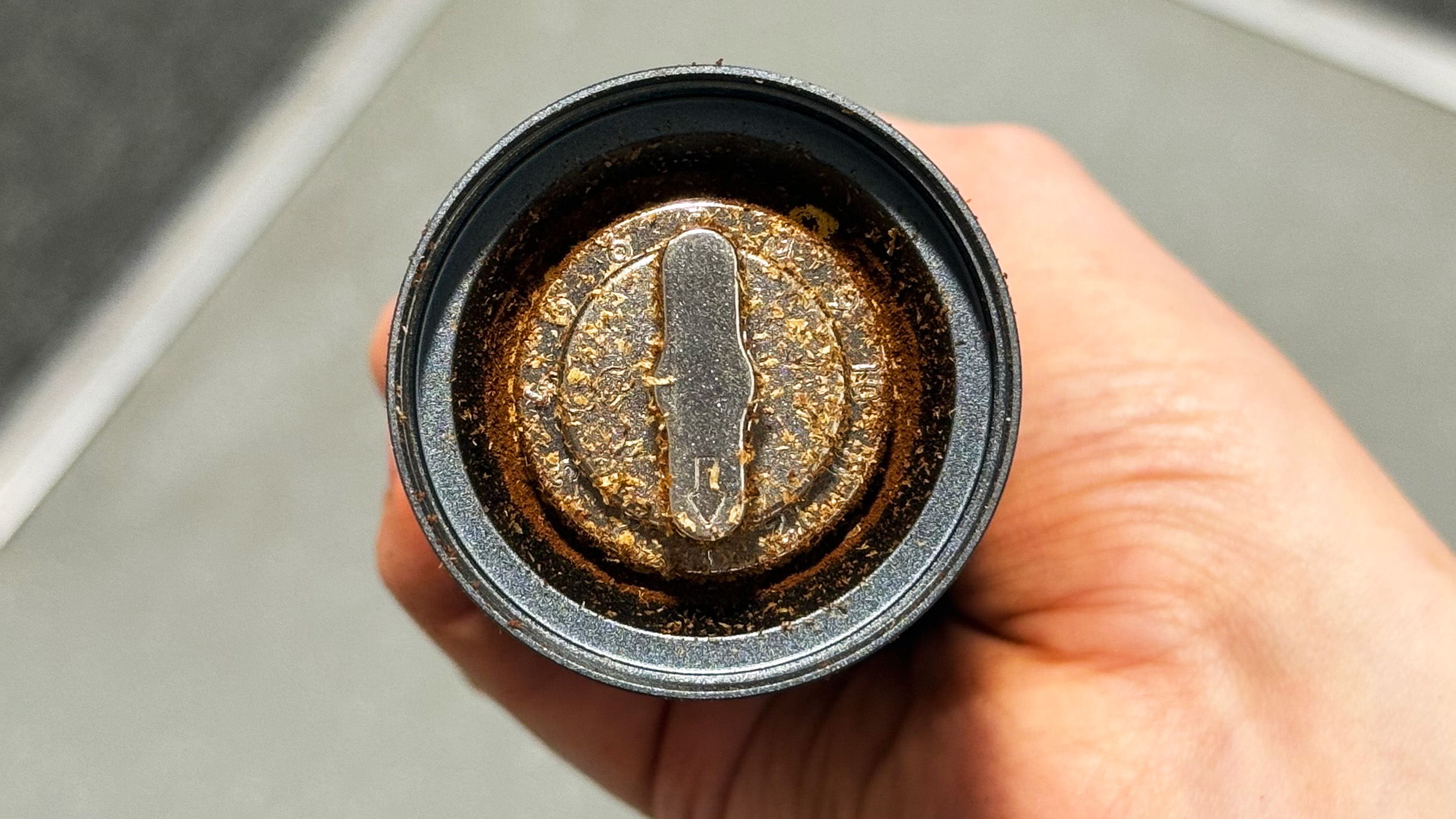 a photo of coffee ground by the aeropress manual coffee grinder
