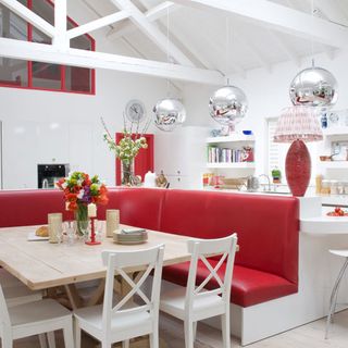 open plan kitchen with red banquette seating