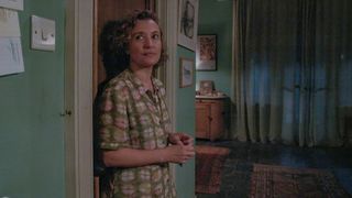Mary Watling (Lyndsey Marshal) leans against the basement door in Inside Man.