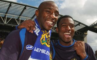 WIGAN, ENGLAND - MAY 8: David Whelan, chairman of Wigan Athletic (L), celebrates with manager Paul Jewell, after they went up to the Premiership during the Coca-Cola Championship match between Wigan Athletic and Reading at the JJB Stadium on May 8, 2005 in Wigan, England. (Photo by Matthew Lewis/Getty Images)