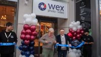 Documentary photographer Martin Parr cutting the ribbon to open Wex Photo Video – pictured next to him is Louis Wahl, Wex Photo Video CEO