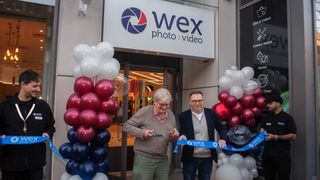 Documentary photographer Martin Parr cutting the ribbon to open Wex Photo Video – pictured next to him is Louis Wahl, Wex Photo Video CEO