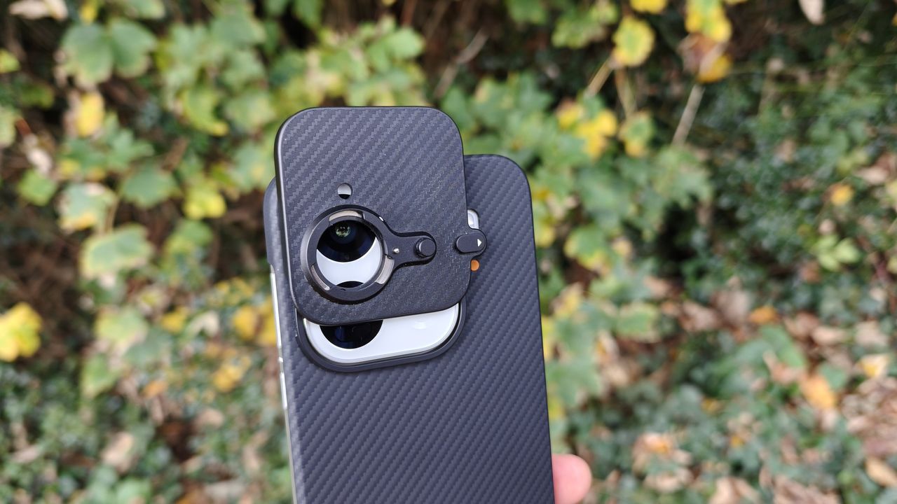 Oppo Find X9 Pro with the extender lens mount partially attached