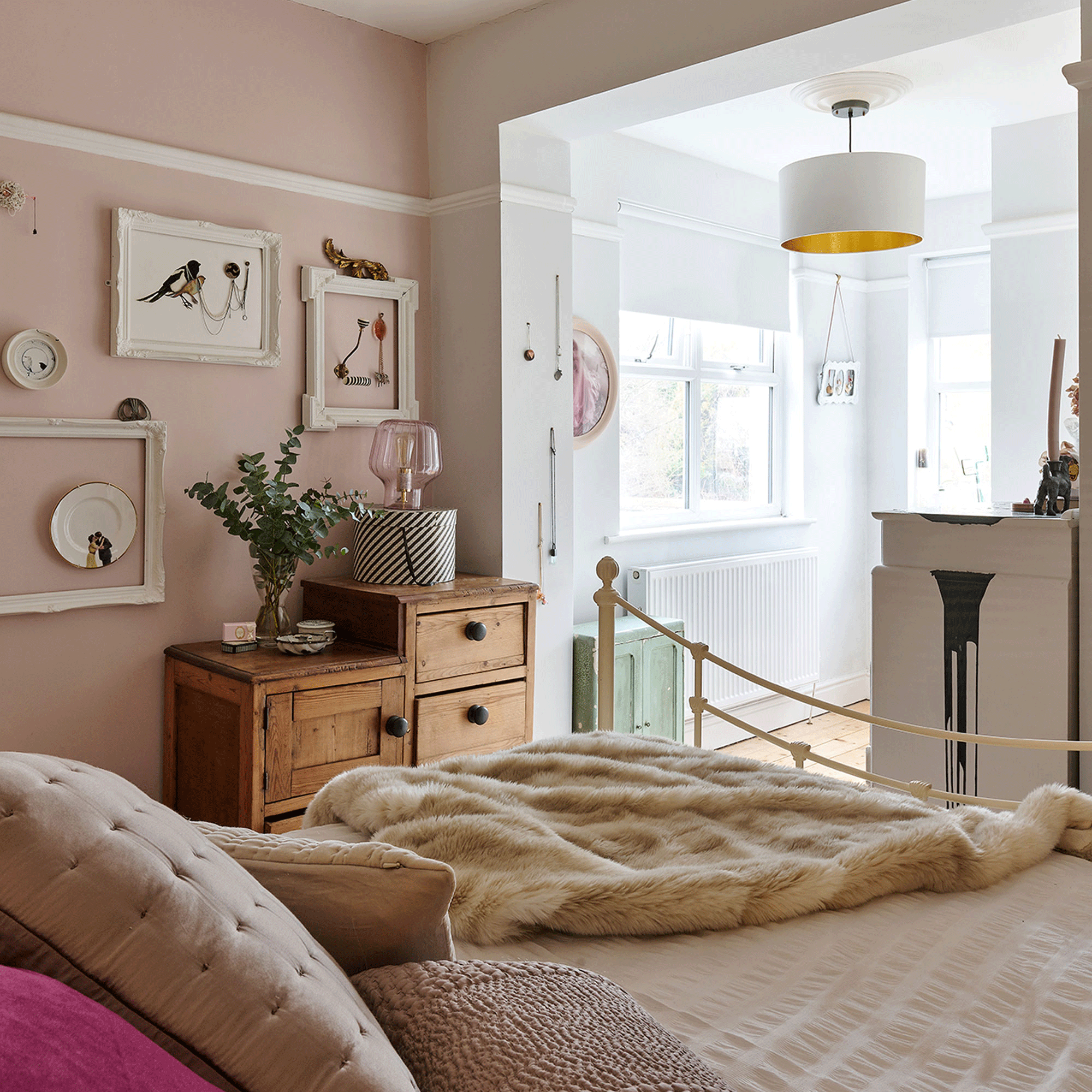 Pink bedroom with fur blanket