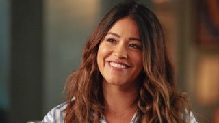 Gina Rodriguez as Nell smiling in Not Dead Yet
