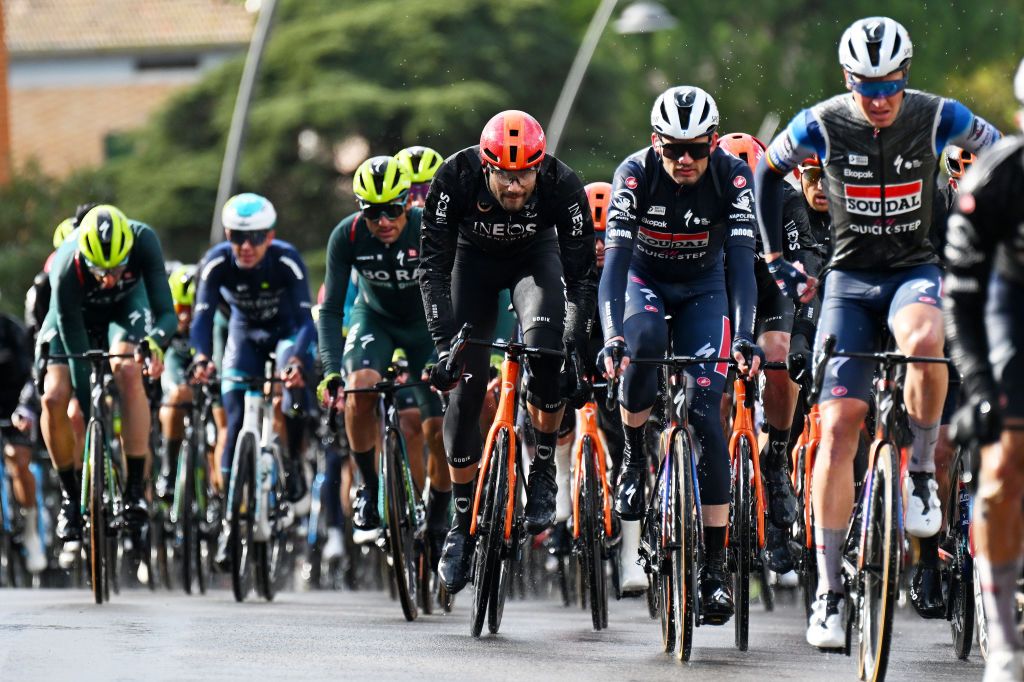 GUALDO TADINO ITALY MARCH 06 LR Filippo Gana of Italy and Team INEOS Grenadiers and Kasper Asgreen of Denmark and Team SoudalQuickstep compete in heavy rain during the 59th TirrenoAdriatico 2024 Stage 3 a 225km stage from Volterra to Gualdo Tadino 527m UCIWT on March 06 2024 in Gualdo Tadino Italy Photo by Tim de WaeleGetty Images