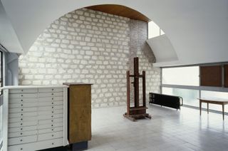 Le Corbusier’s private studio space with arch and exposed brickwork.