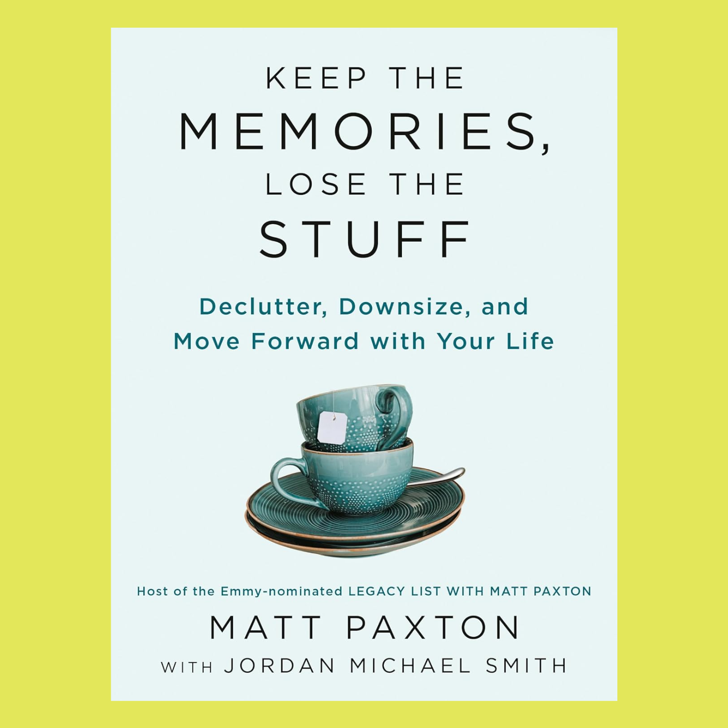A light blue paperback book titled 'Keep The Memories, Lose The Stuff' by Matt Paxton