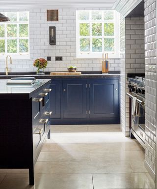 Kitchen with indigo cabinets and metro tile wall