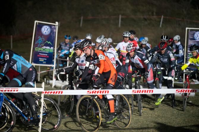 A big men's field runs into a traffic jam on the first lap.
