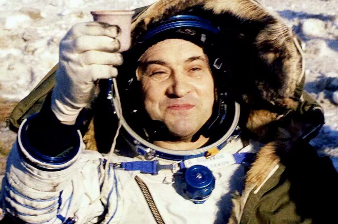 Cosmonaut Valery Polyakov raises a toast after landing