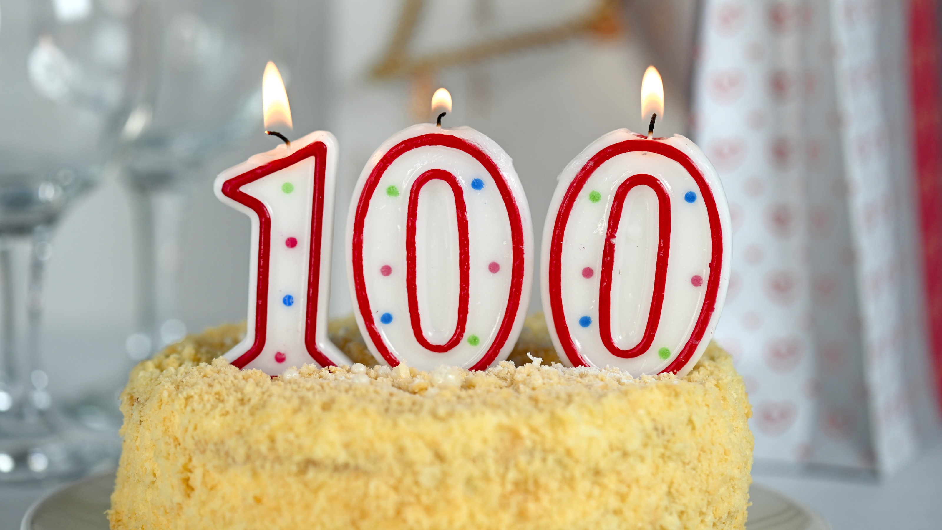 Lighted numbered candles on a birthday cake for a 100-year-old.