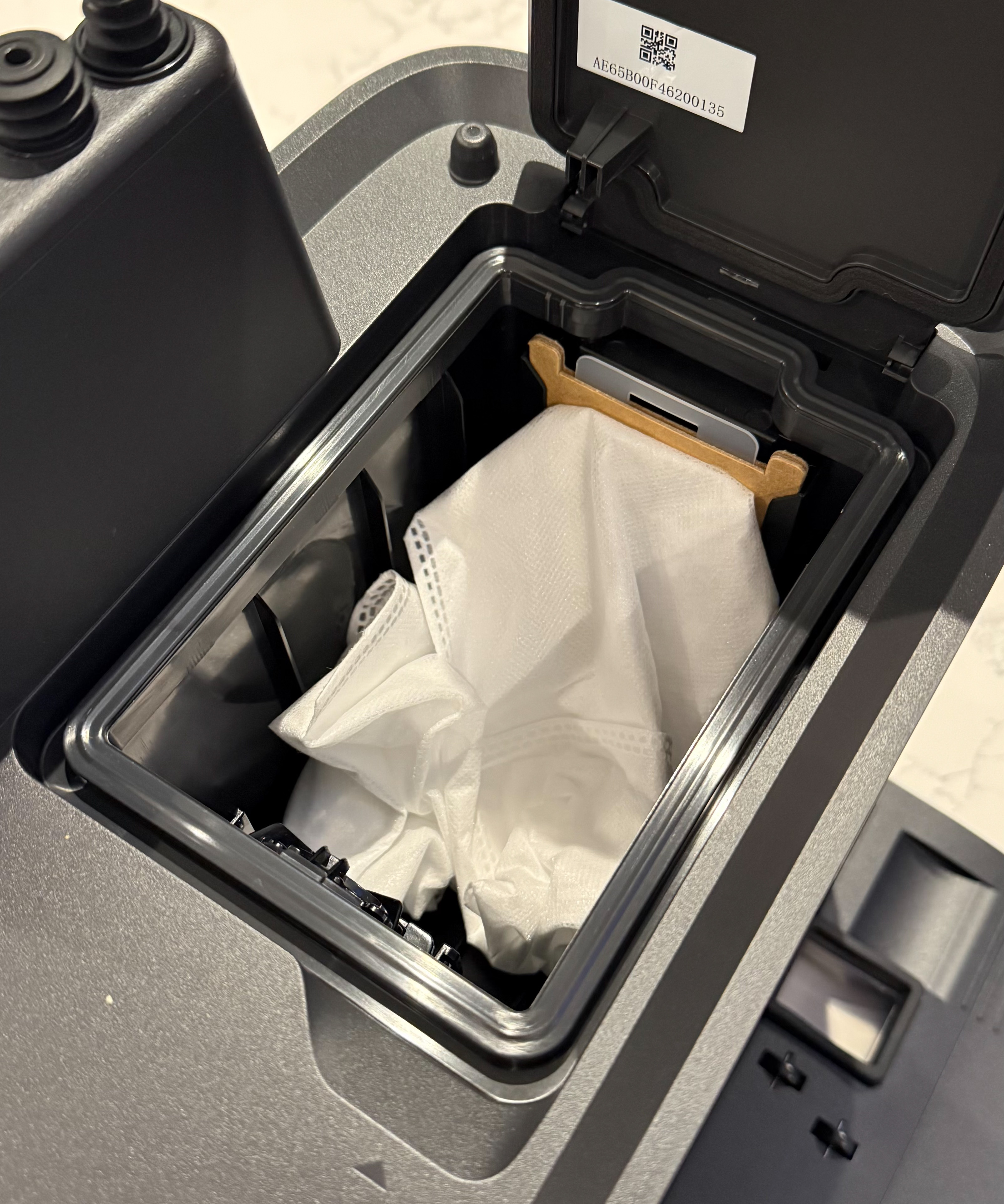 eufy Omni C28 self-emptying base station showing installed dust bag compartment
