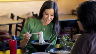 Lisa Ling eating in Take Out with Lisa LIng