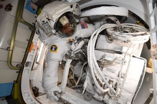 Today, NASA astronauts Victor Glover and Mike Hopkins are stepping outside the International Space Station for Glover's first spacewalk, or extravehicular activity (EVA). In this photo, you can see Glover preparing for the spacewalk, which will be his first. During the EVA, the pair will install a new antenna on the Columbus module on the outside of the space station.