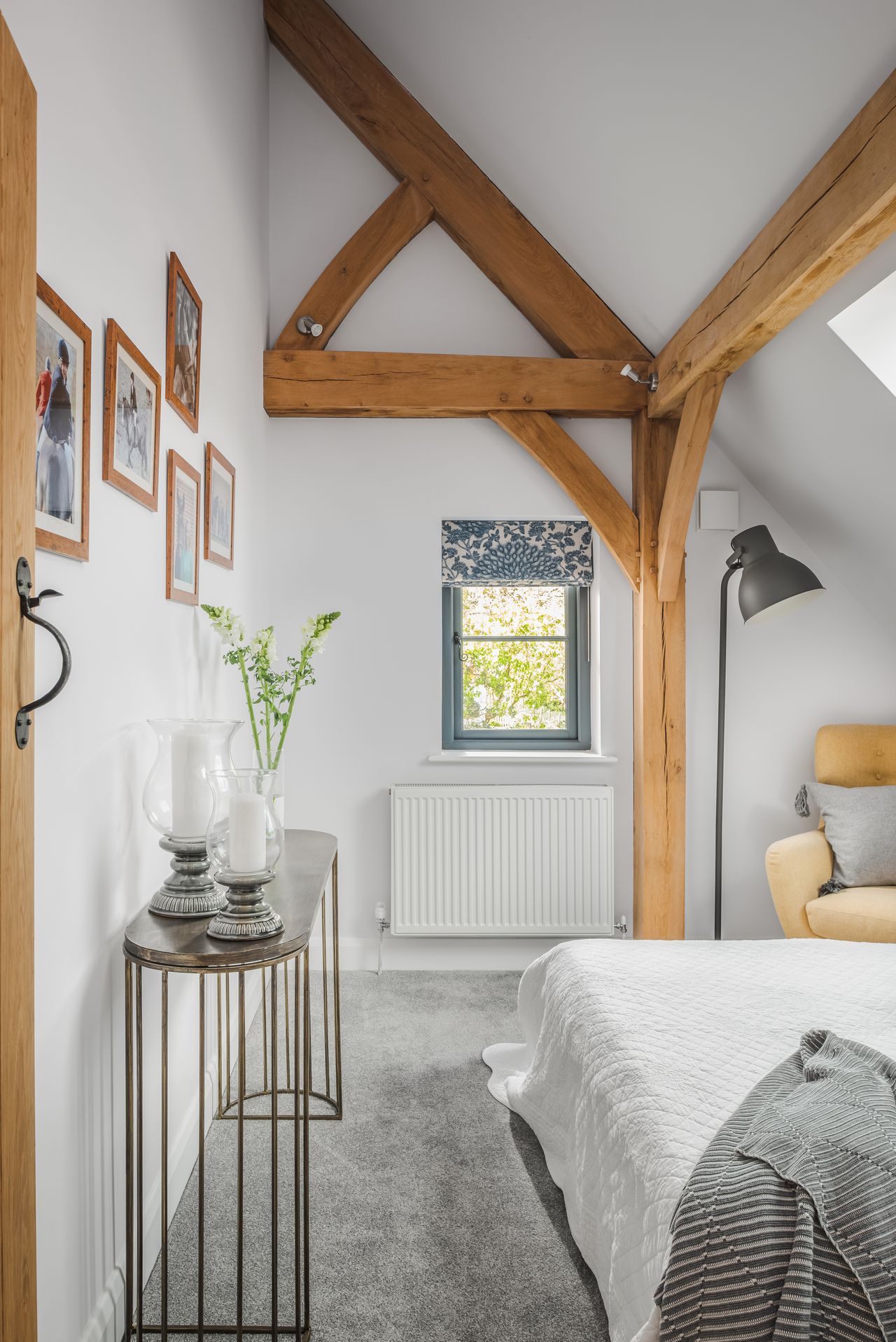 bedroom with vaulted ceiling and spotlights