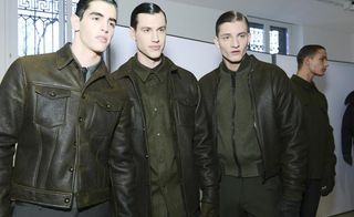 Three models wearing green CK jackets