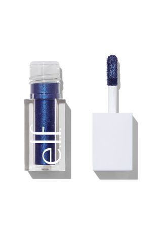 an open bottle of e.l.f. Cosmetics liquid glitter eyeshadow in blue 