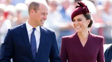 Prince William and Catherine, Princess of Wales smile at each other as they arrive to attend a service to commemorate the life of Her Late Majesty Queen Elizabeth II at St Davids Cathedral on September 8, 2023