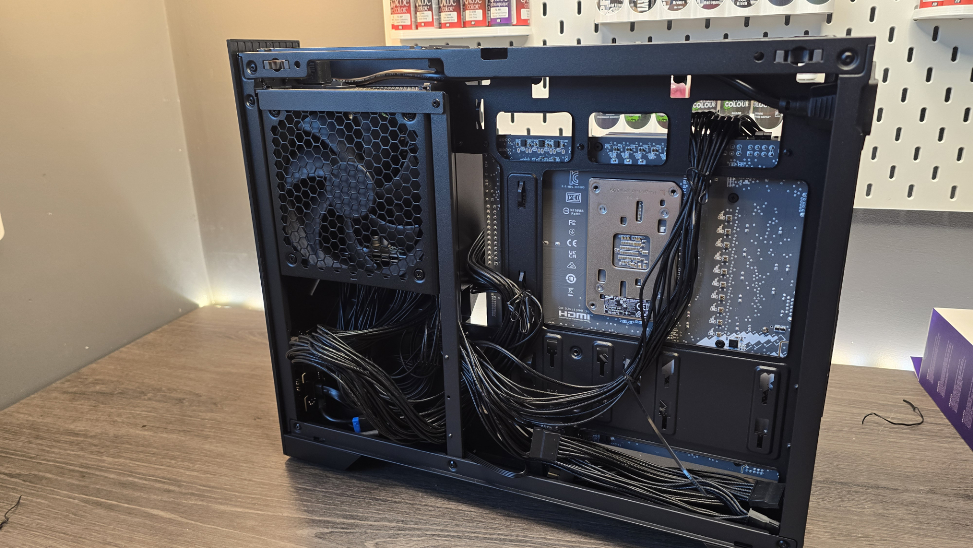 A Phanteks XT V3 PC case on a desk with various PC parts.