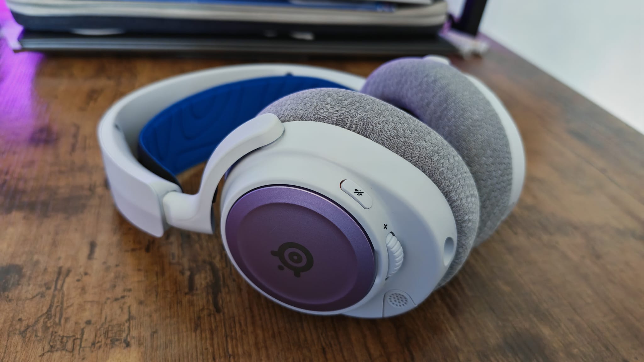 Purple and blue accessories on the SteelSeries Arctis Nova 7P
