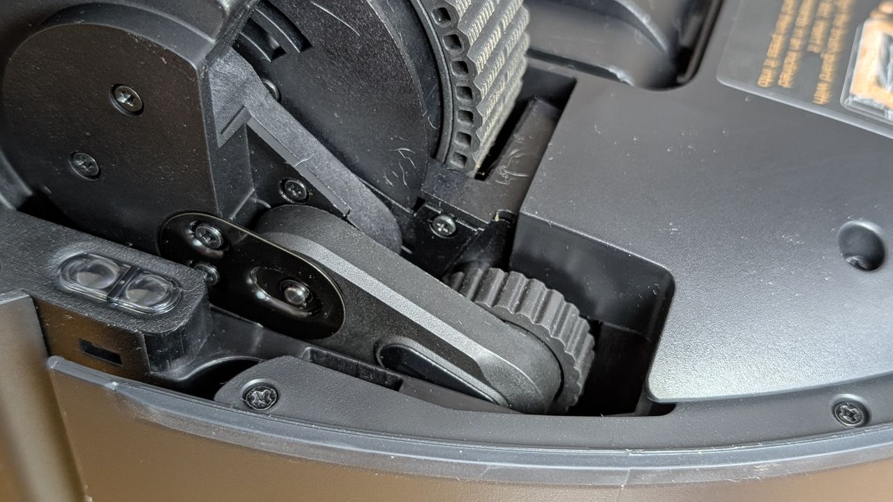 Dreame Matrix10 Ultra robovac showing close up details of the step climbing mini wheel and leg