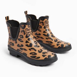 Cutouts of short leopard print wellies from Tu against a white backdrop