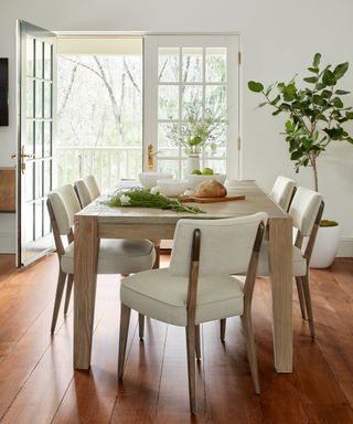 Kitchen diner with a house tree displayed in an unused corner