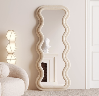 wavy mirror with light wood frame