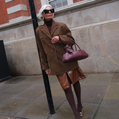 @greceghanem wears brown suede blazer and skirt