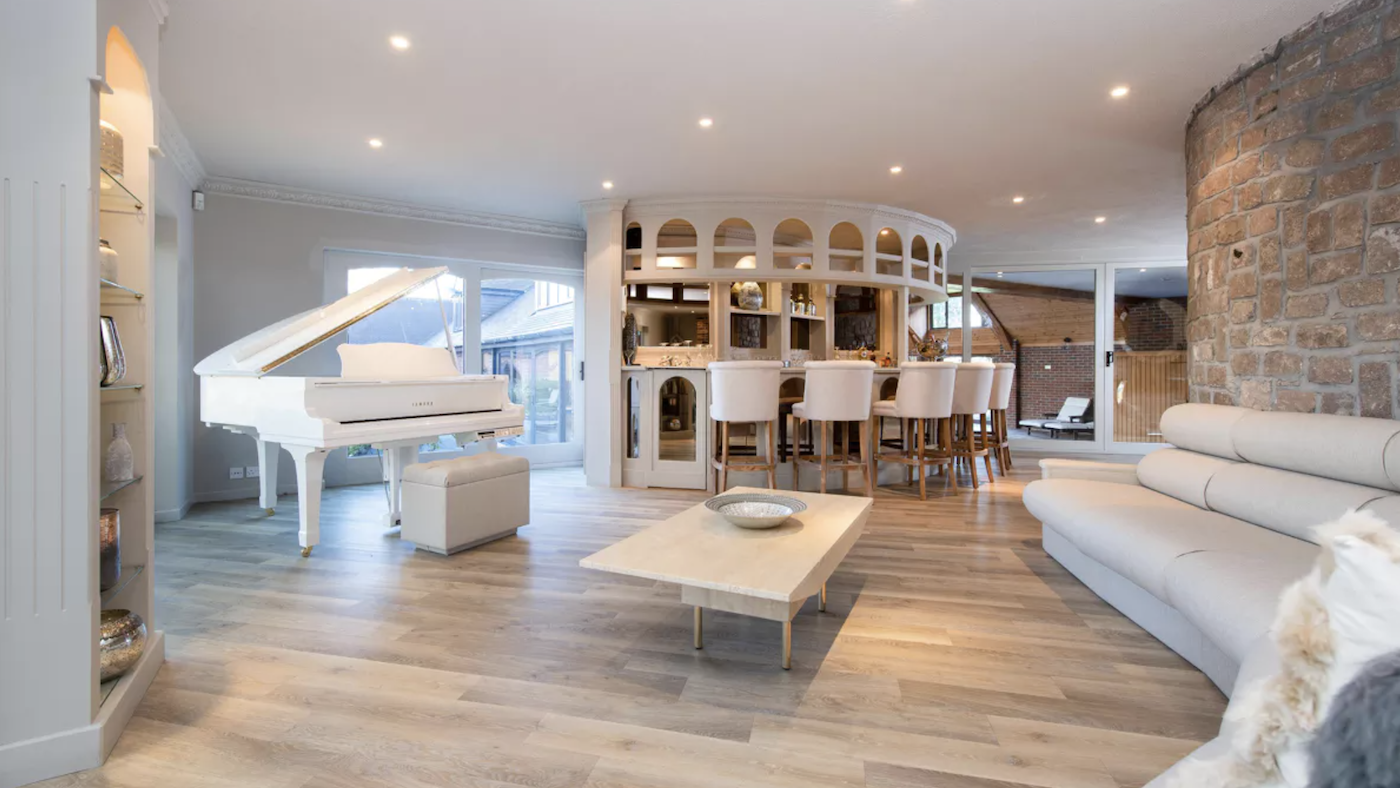 Modern reception room with white grand piano