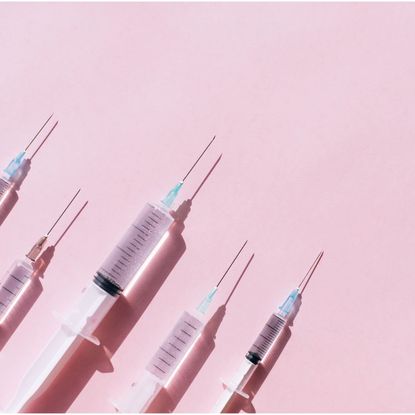 Black market Ozempic: Needles against a pink background