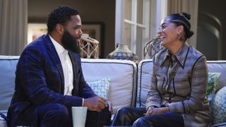Anthony Anderson and Tracee Ellis Ross sit on a couch in black-ish