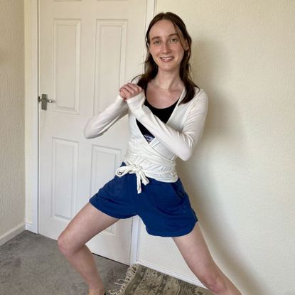 Health writer Katie Sims trying standing Pilates, at home in her office