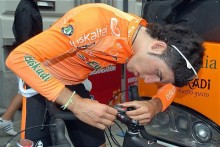 Javier Armendia (Euskaltel-Euskadi) makes adjustments to his bike.