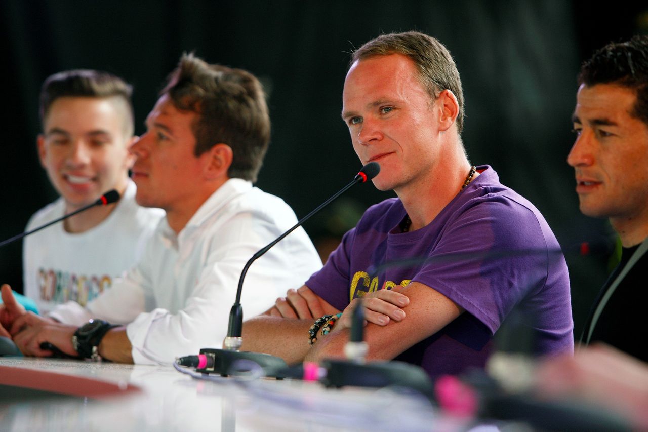Chris Froome speaks with the press