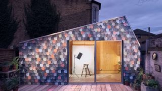 contemporary extension with recycled multi-coloured tile hung cladding
