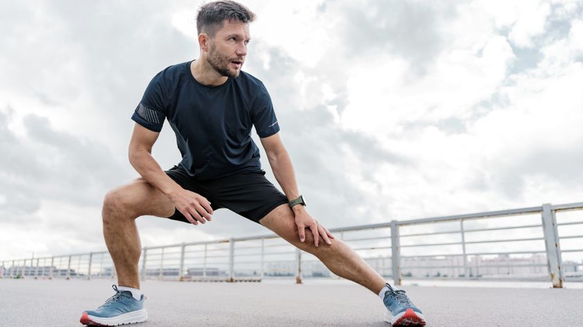 a man stretching into a side lunge