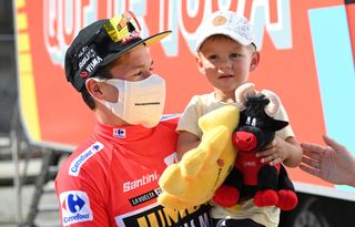 MONFORTE DE LEMOS SPAIN SEPTEMBER 03 Primoz Roglic of Slovenia and Team Jumbo Visma red leader jersey celebrates with his son Levom after the 76th Tour of Spain 2021 Stage 19 a 1912 km stage from Tapia to Monforte de Lemos lavuelta LaVuelta21 on September 03 2021 in Monforte de Lemos Spain Photo by Stuart FranklinGetty Images